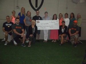 Pictured presenting the check are – Front row, kneeling; Phil Cappelini, Ned Collins, Renee Marcinek, Nadine Homentosky and Steve Baronski. Standing: Amy Shwed, Leann Symuleski, Jennelle Wasilchak, Mike Marcinek, UCP Executive Director Sarah Drob, Danielle Alu, Wendy Yankelitis, Jessica Kearney, Karen Ross and UCP Board President Lynn Hutchings. Additional committee members were: Antoinett Bonacci, Deb Cosenza, Jon Dressler, Maggie Ferraro. Jennifer Loftus, Matt Marcinek, Myron Marcinek, Lyn Passeri, Holly Scacchitti and Anita Young.
